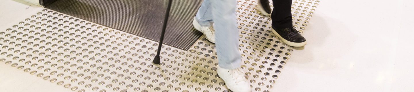 accessible infrastructure example - tactile indicators with an escalator