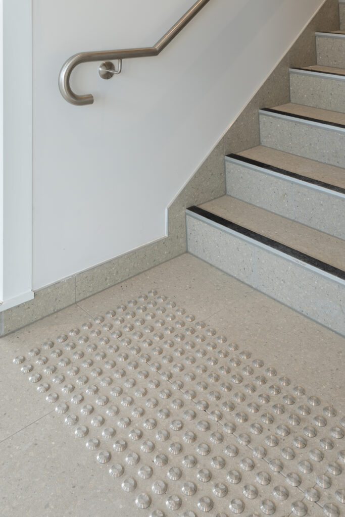 stair nosings and tactile indicator installation for botanical village